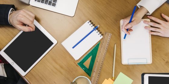 crop-coworkers-with-devices-stationery